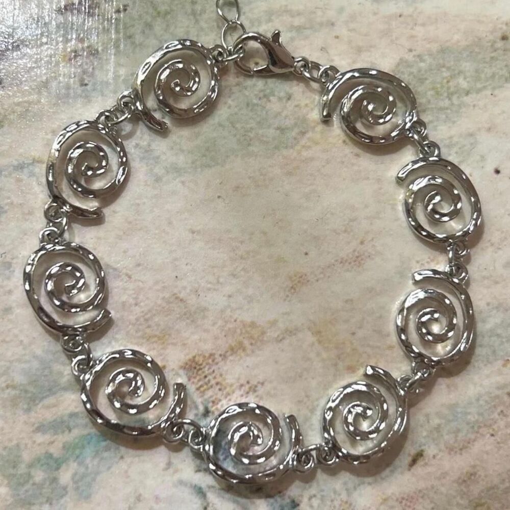 whimsical silver plated swirl bracelet, adjustable